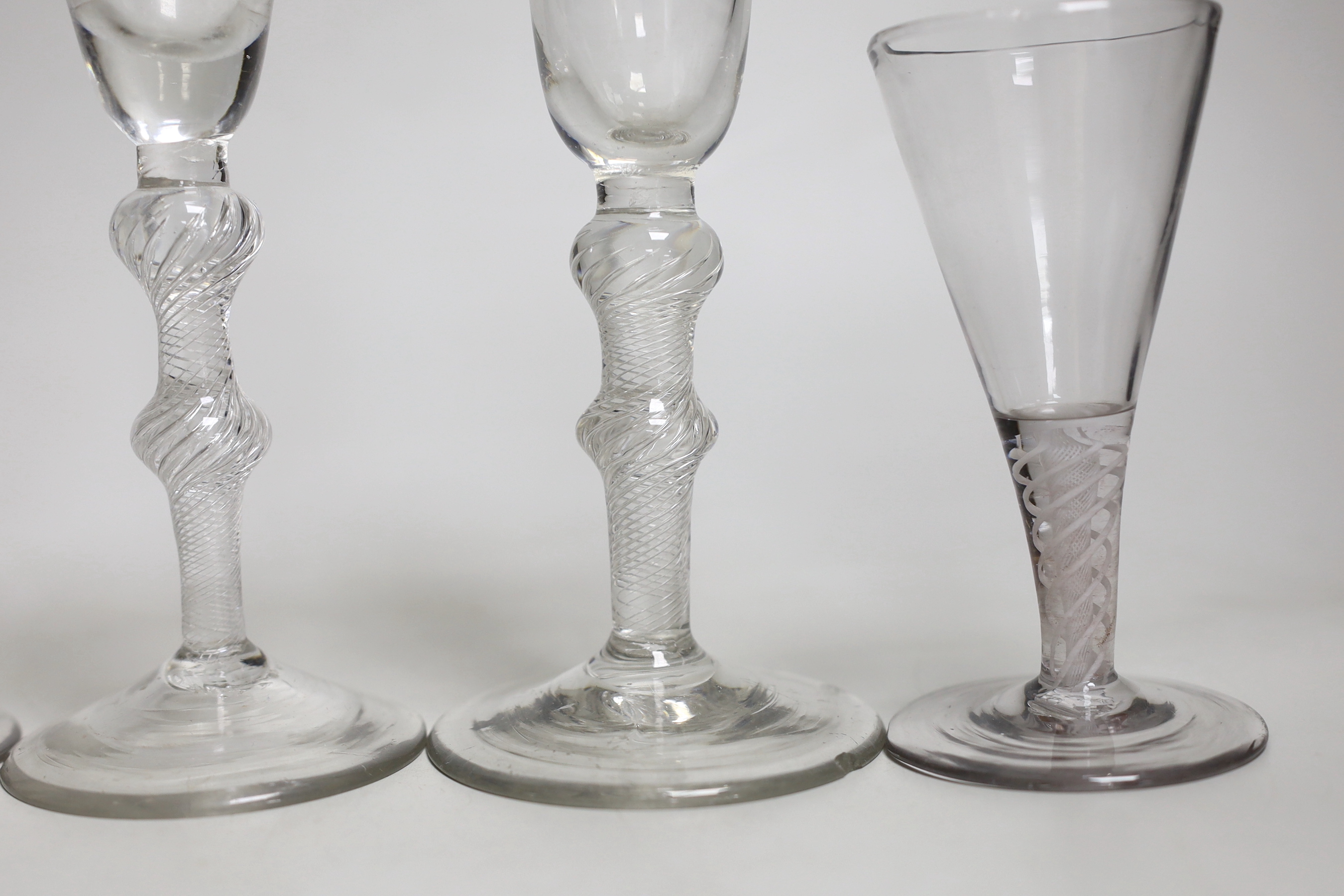 Two George II airtwist stem cordial or wine glasses, tallest 20cm high, a George III DSOT wine glass and two Continental DSOT glasses